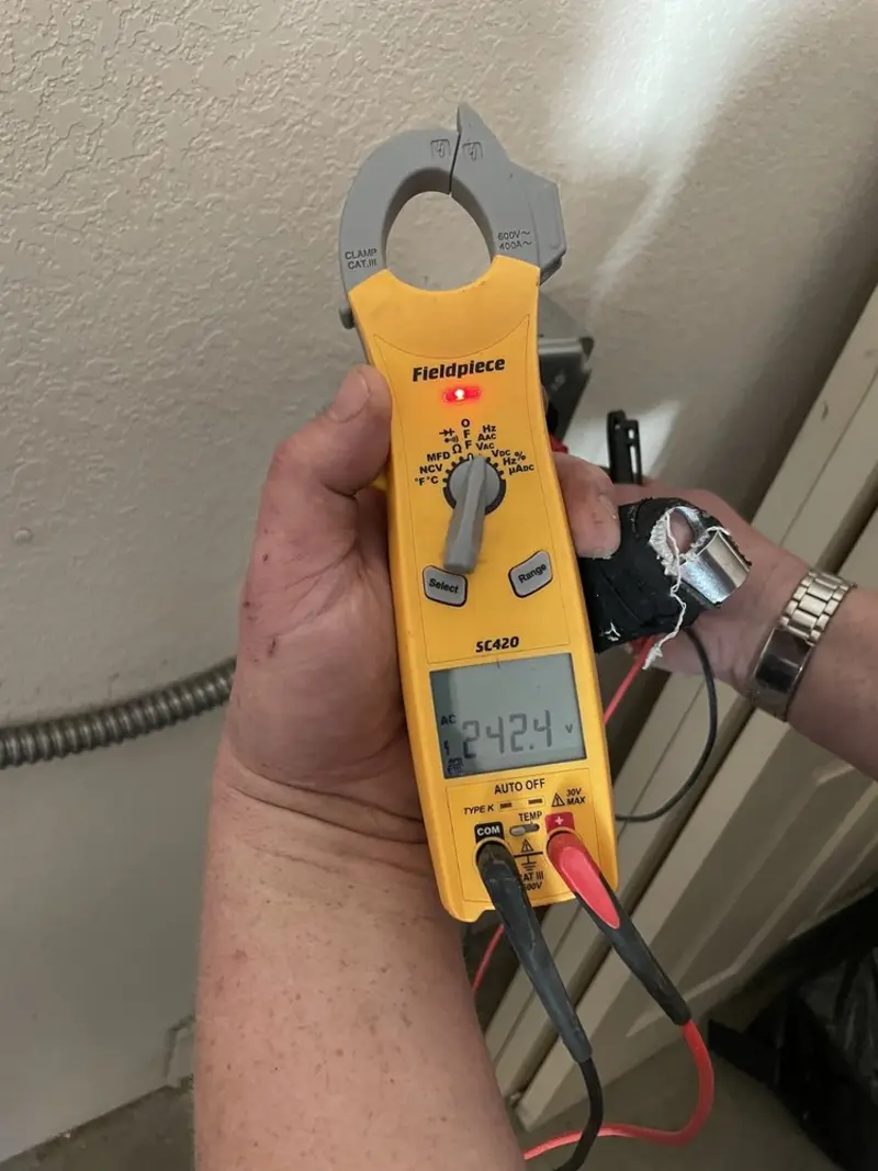Voltage testing with clamp meter during Outlet Installation in Lancaster